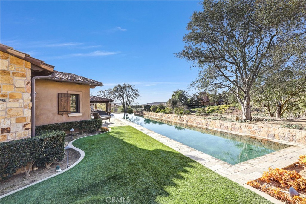 41 Needle Grass Irvine, CA 92603 - Photo 54 of 64 a view of a house with swimming pool and sitting area