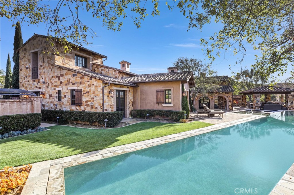 41 Needle Grass Irvine, CA 92603 - Photo 55 of 64 a view of a house with swimming pool and a yard