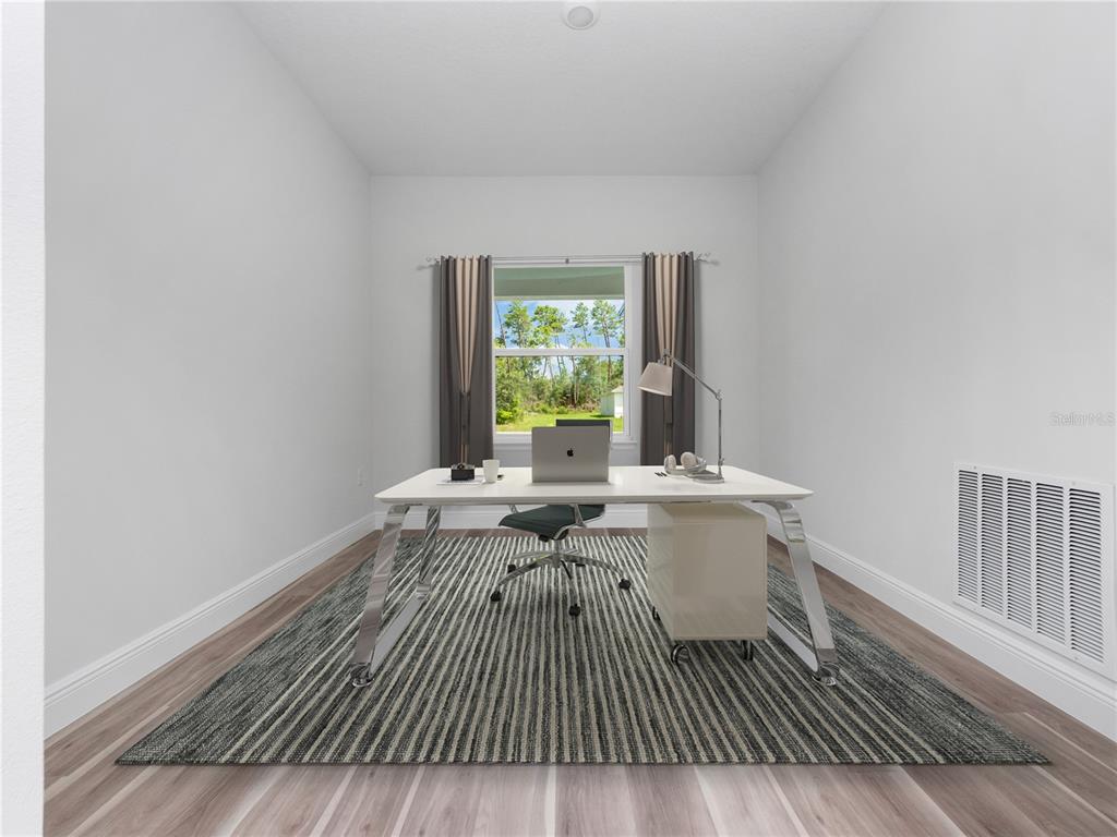 3310 Southwest 177th Lane Road Ocala, FL 34473 - Photo 14 of 40 a view of a room with wooden floor pool table and windows