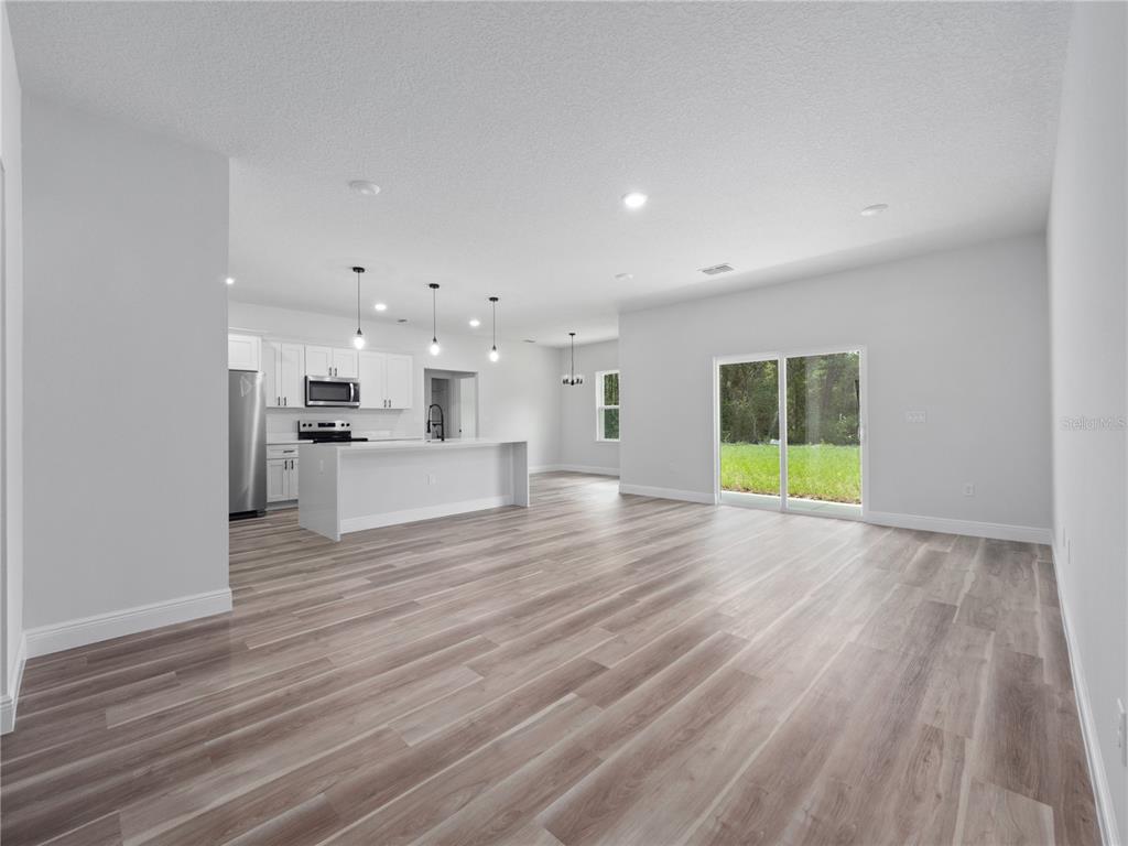 3310 Southwest 177th Lane Road Ocala, FL 34473 - Photo 15 of 40 a view of a kitchen with a sink and a stove top oven