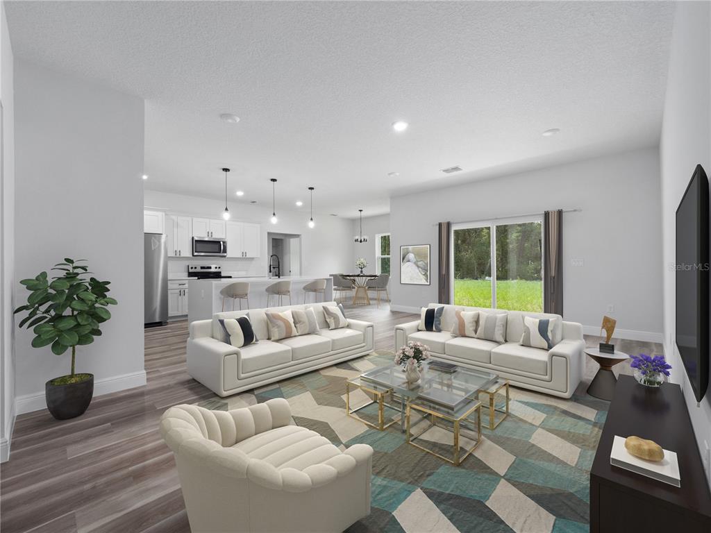 3310 Southwest 177th Lane Road Ocala, FL 34473 - Photo 16 of 40 a living room with furniture and a large window