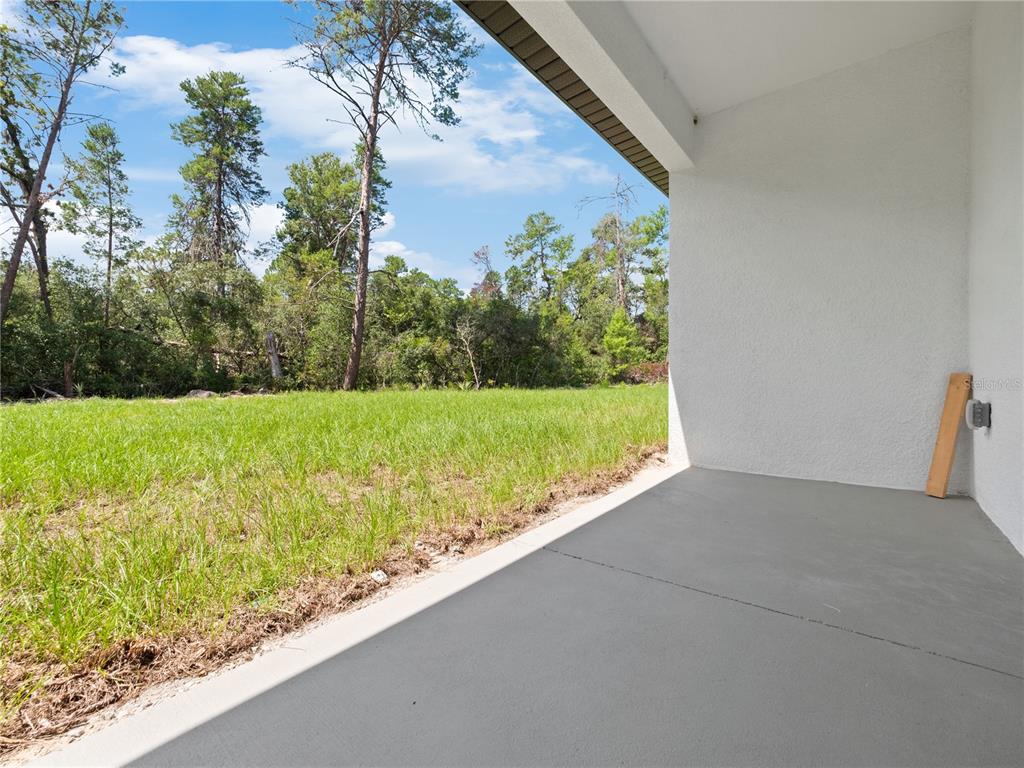 3310 Southwest 177th Lane Road Ocala, FL 34473 - Photo 31 of 40 a view of a garden with an outdoor space