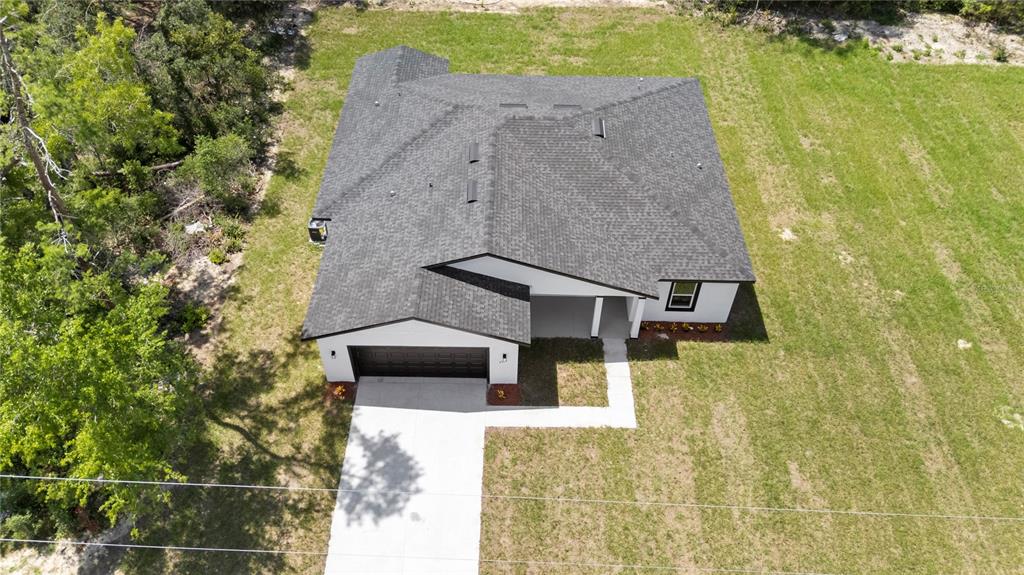 3310 Southwest 177th Lane Road Ocala, FL 34473 - Photo 36 of 40 an aerial view of a house with a yard