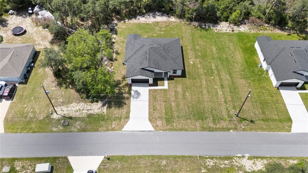 3310 Southwest 177th Lane Road Ocala, FL 34473 - Photo 37 of 40 view of swimming pool with a yard