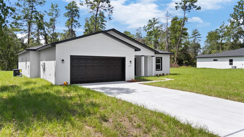 3310 Southwest 177th Lane Road Ocala, FL 34473 - Photo 40 of 40 a view of outdoor space yard and garage