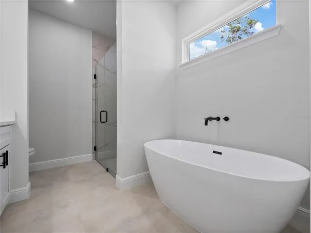 a white bath tub sitting in a bathroom