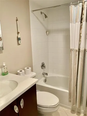 a bathroom with a sink a toilet and a bathtub