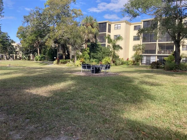 a view of a patio with a table and chairs