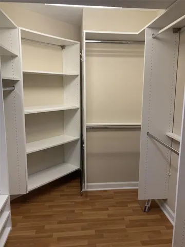 a view of an empty walk in closet