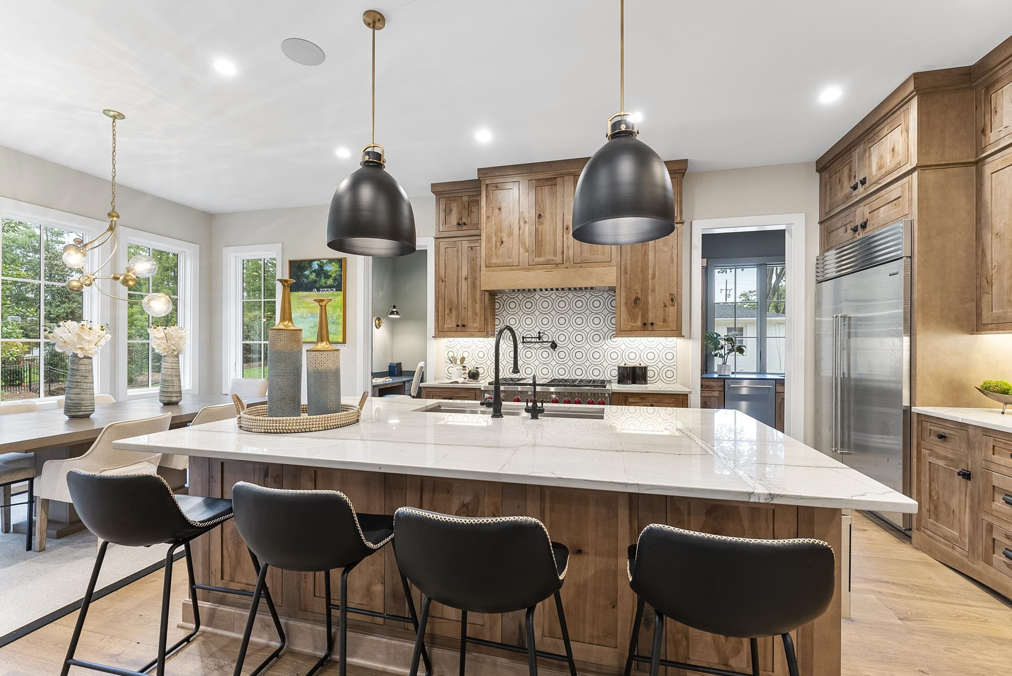 2312 Airline Drive Raleigh, NC 27607 - Photo 11 of 54 a kitchen with stainless steel appliances granite countertop a sink a stove and a wooden floor
