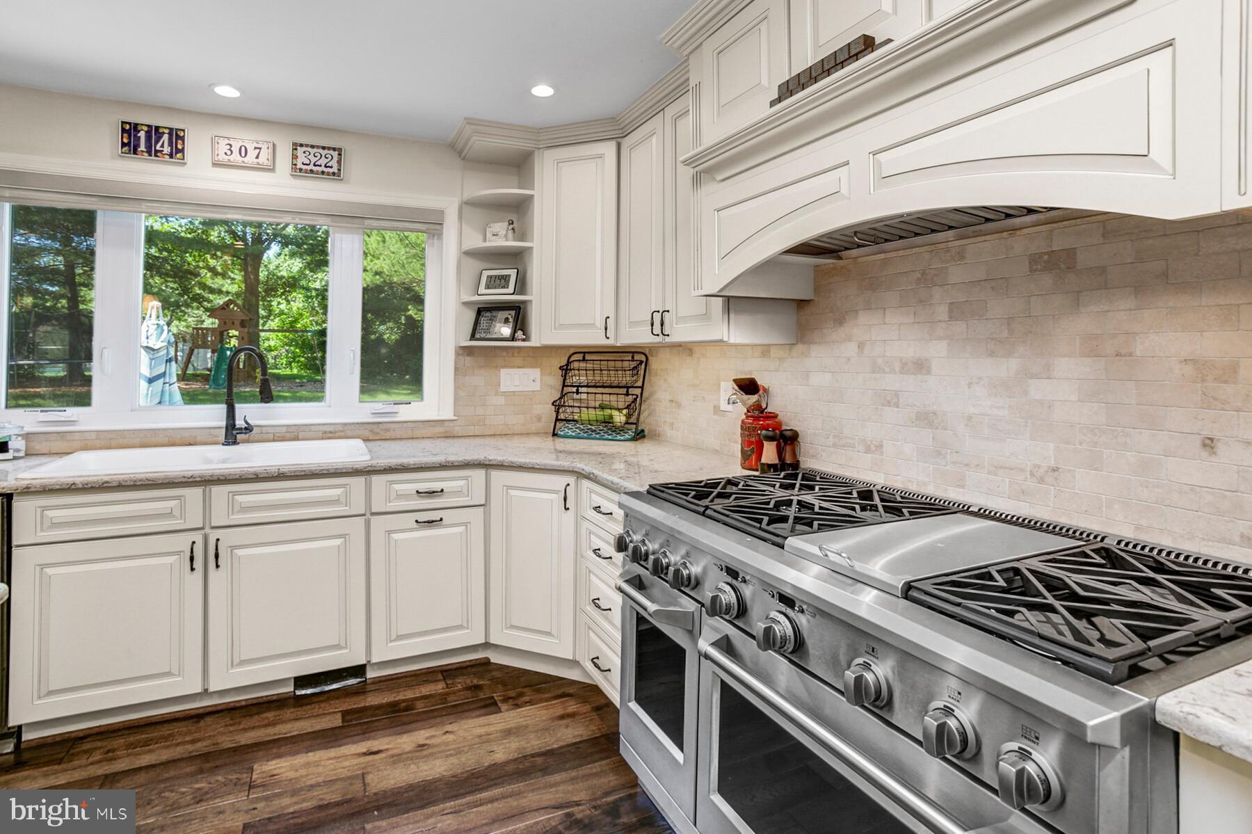 307 Saddle Ridge Road Annapolis, MD 21403 - Photo 9 of 46 a kitchen with stainless steel appliances granite countertop a stove and a sink