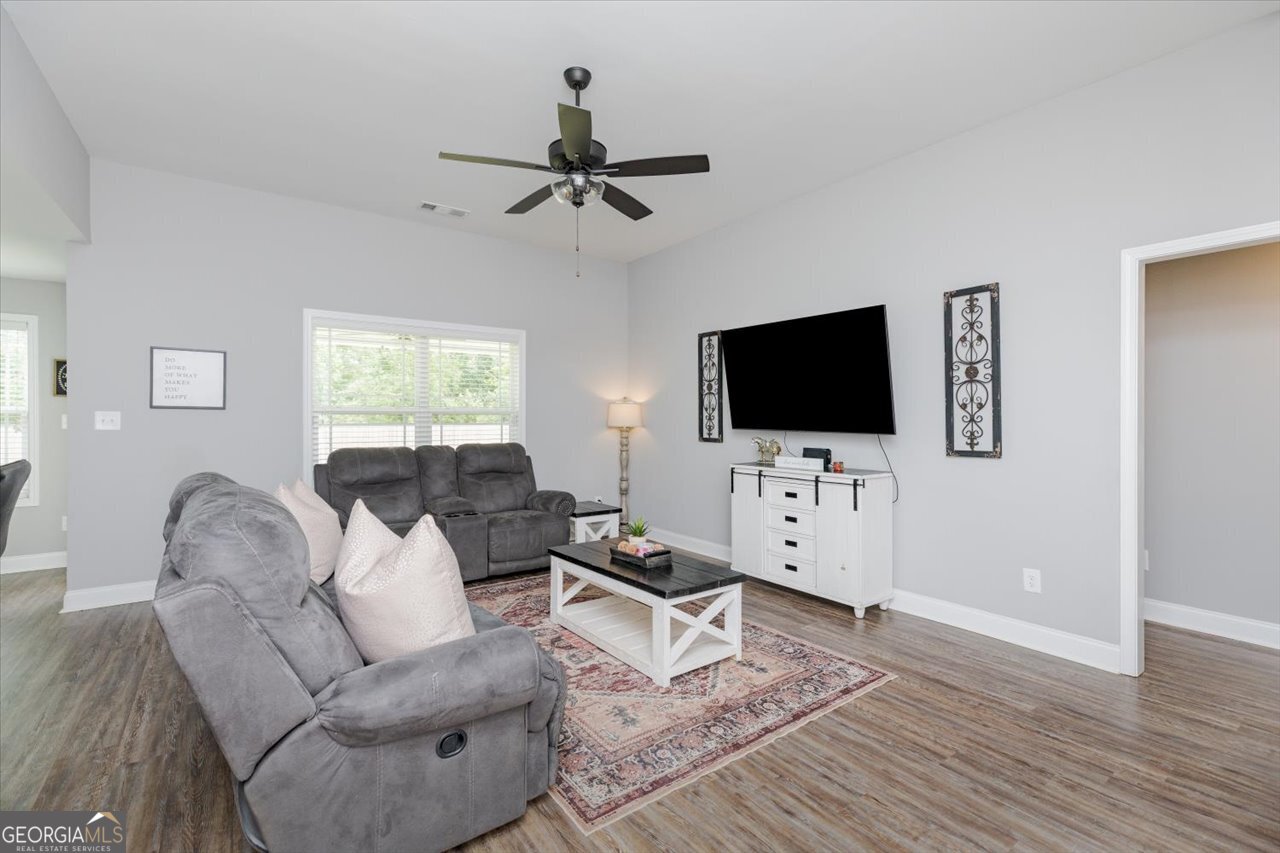 104 Meredith Layne Court Perry, GA 31069 - Photo 7 of 46 a living room with furniture and a flat screen tv