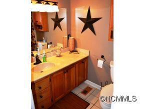 118 Riverside Drive Canton, NC 28716 - Photo 11 of 21 a kitchen with sink and mirror