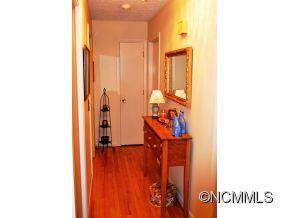 118 Riverside Drive Canton, NC 28716 - Photo 14 of 21 a view of a hallway with wooden floor