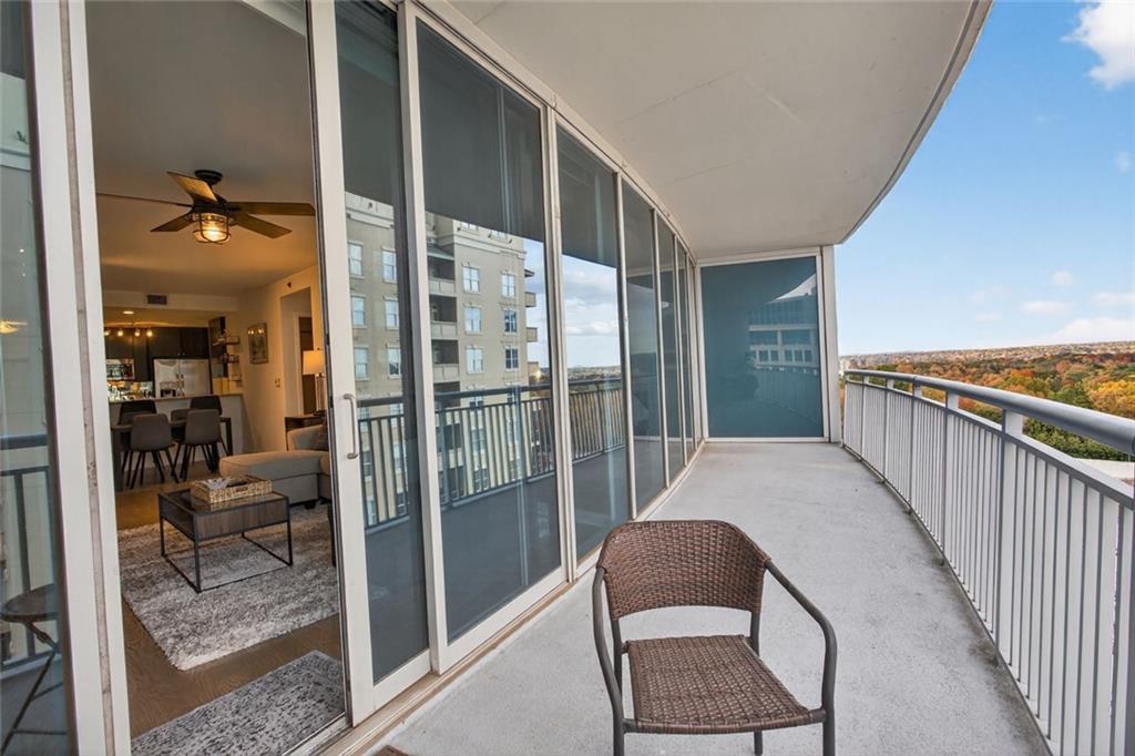 3338 Peachtree Road Northeast, Unit 1706 Atlanta, GA 30326 - Photo 15 of 35 a balcony view with a glass door