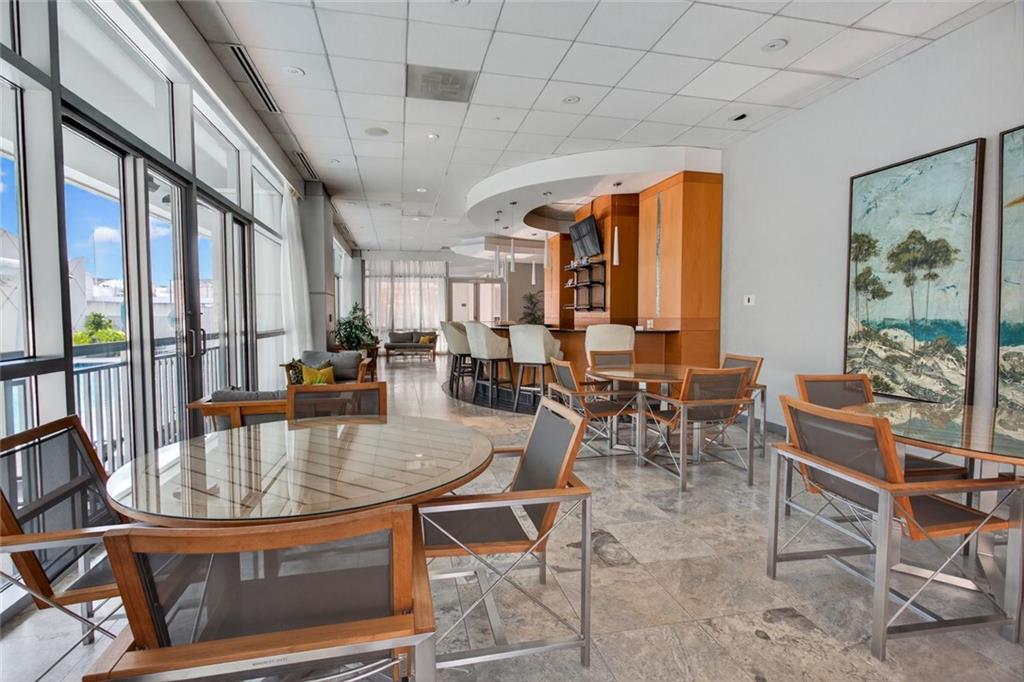 3338 Peachtree Road Northeast, Unit 1706 Atlanta, GA 30326 - Photo 18 of 35 a view of a dining room with furniture window and outside view