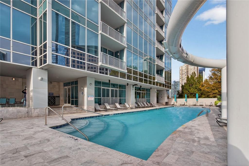 3338 Peachtree Road Northeast, Unit 1706 Atlanta, GA 30326 - Photo 22 of 35 a view of a building with a yard