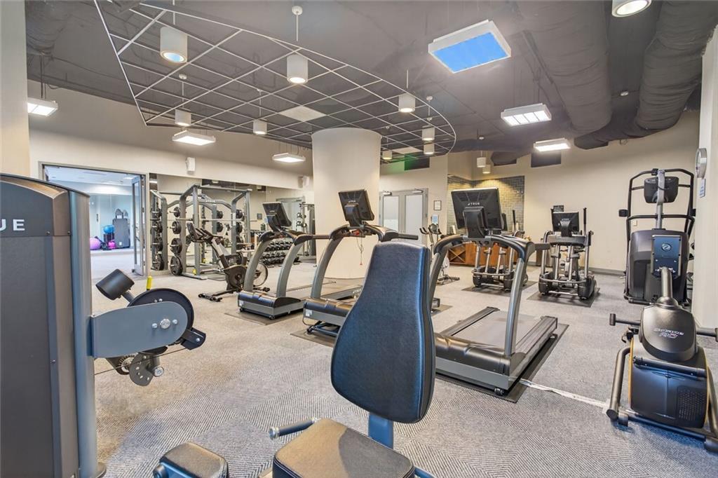3338 Peachtree Road Northeast, Unit 1706 Atlanta, GA 30326 - Photo 24 of 35 a view of a room with gym equipment