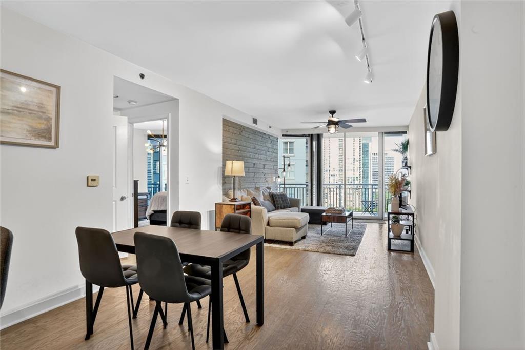 3338 Peachtree Road Northeast, Unit 1706 Atlanta, GA 30326 - Photo 3 of 35 a view of a a dining room with furniture window and wooden floor