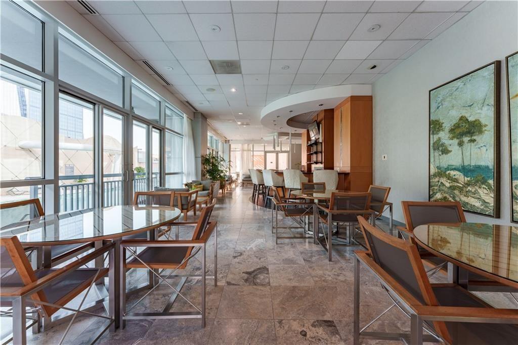 3338 Peachtree Road Northeast, Unit 1706 Atlanta, GA 30326 - Photo 31 of 35 a view of a dining room with furniture window and outside view