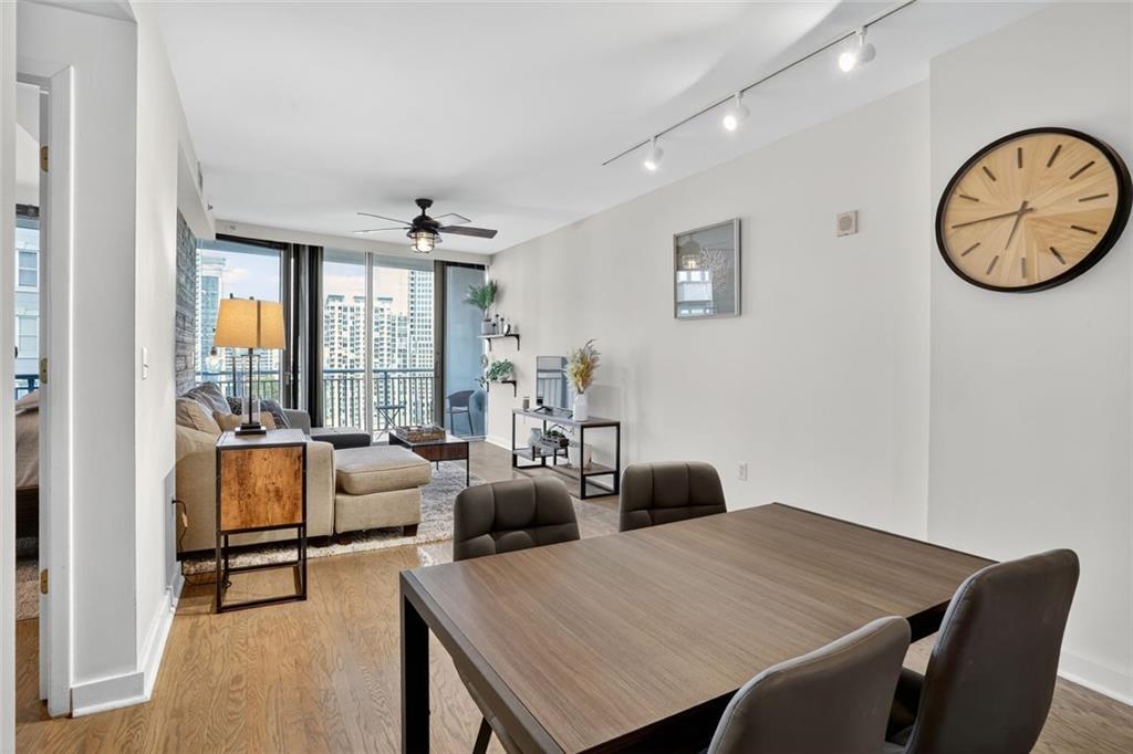 3338 Peachtree Road Northeast, Unit 1706 Atlanta, GA 30326 - Photo 5 of 35 a view of a dining room with furniture window and outside view