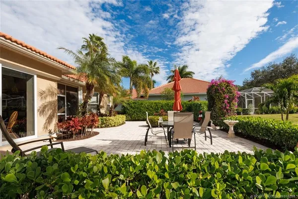 an aerial view of a house with yard