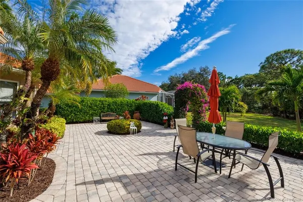 a view of a house with a yard and lake view