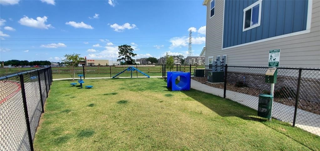 21155 Gosling Road, Unit 37 Spring, TX 77388 - Photo 11 of 11 a backyard of a house with table and chairs