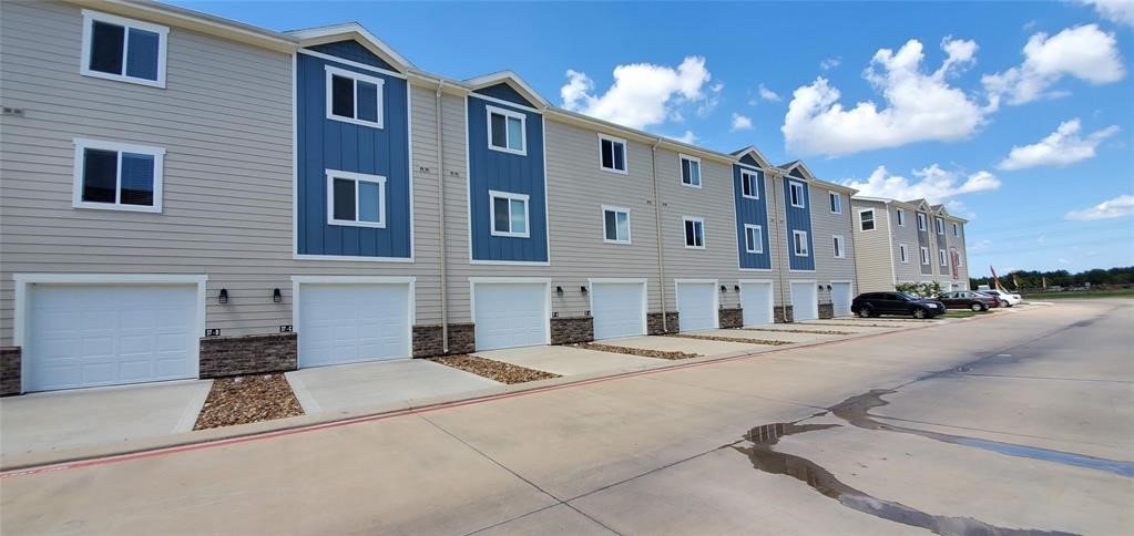 21155 Gosling Road, Unit 37 Spring, TX 77388 - Photo 3 of 11 a view of a building with a street