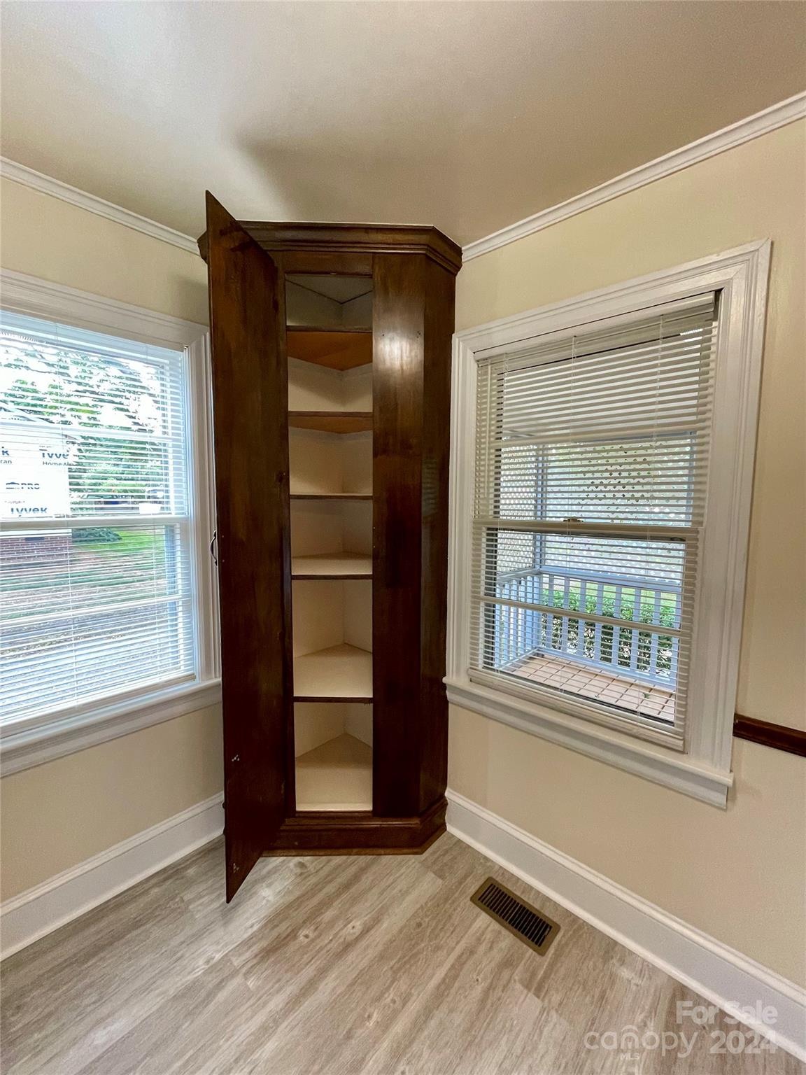 304 Rhyne Street Stanley, NC 28164 - Photo 13 of 38 an empty room with wooden floor and windows