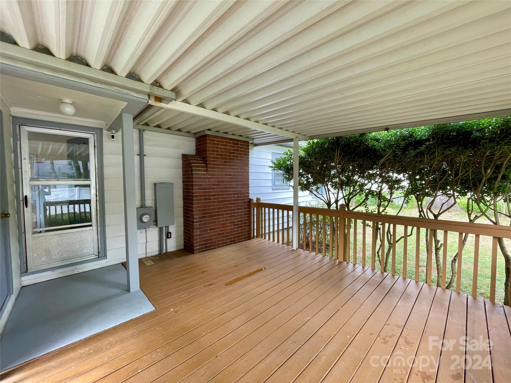 304 Rhyne Street Stanley, NC 28164 - Photo 19 of 38 a balcony with wooden floor and outdoor space