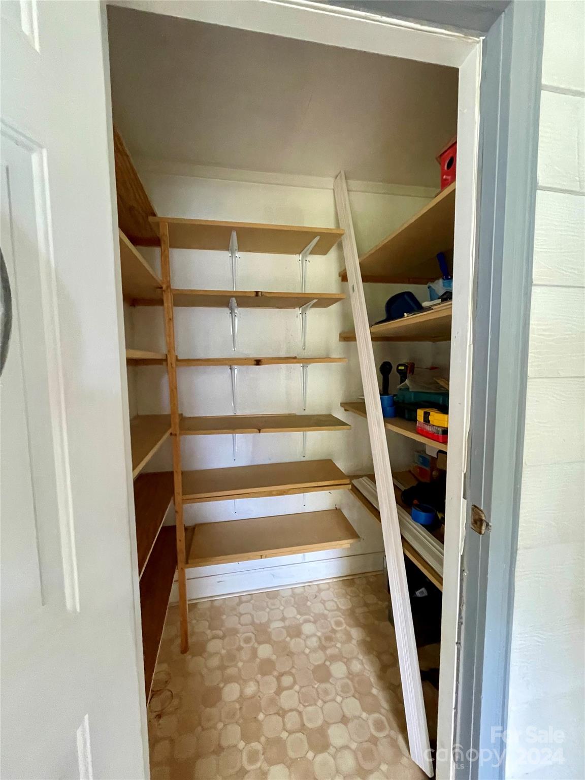 304 Rhyne Street Stanley, NC 28164 - Photo 20 of 38 a view of walk in closet with clothes and shoes