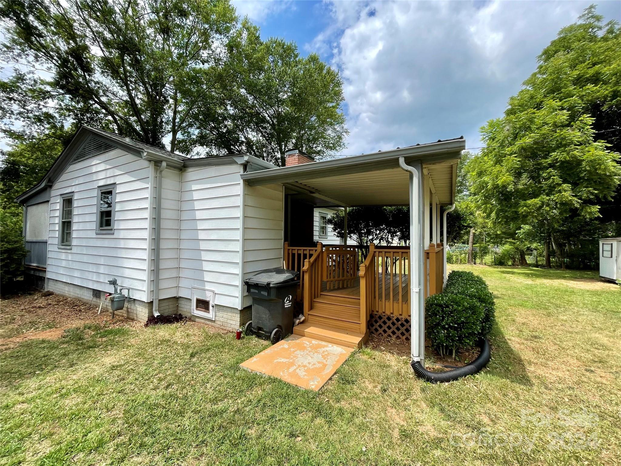 304 Rhyne Street Stanley, NC 28164 - Photo 21 of 38 a front view of a house with a yard