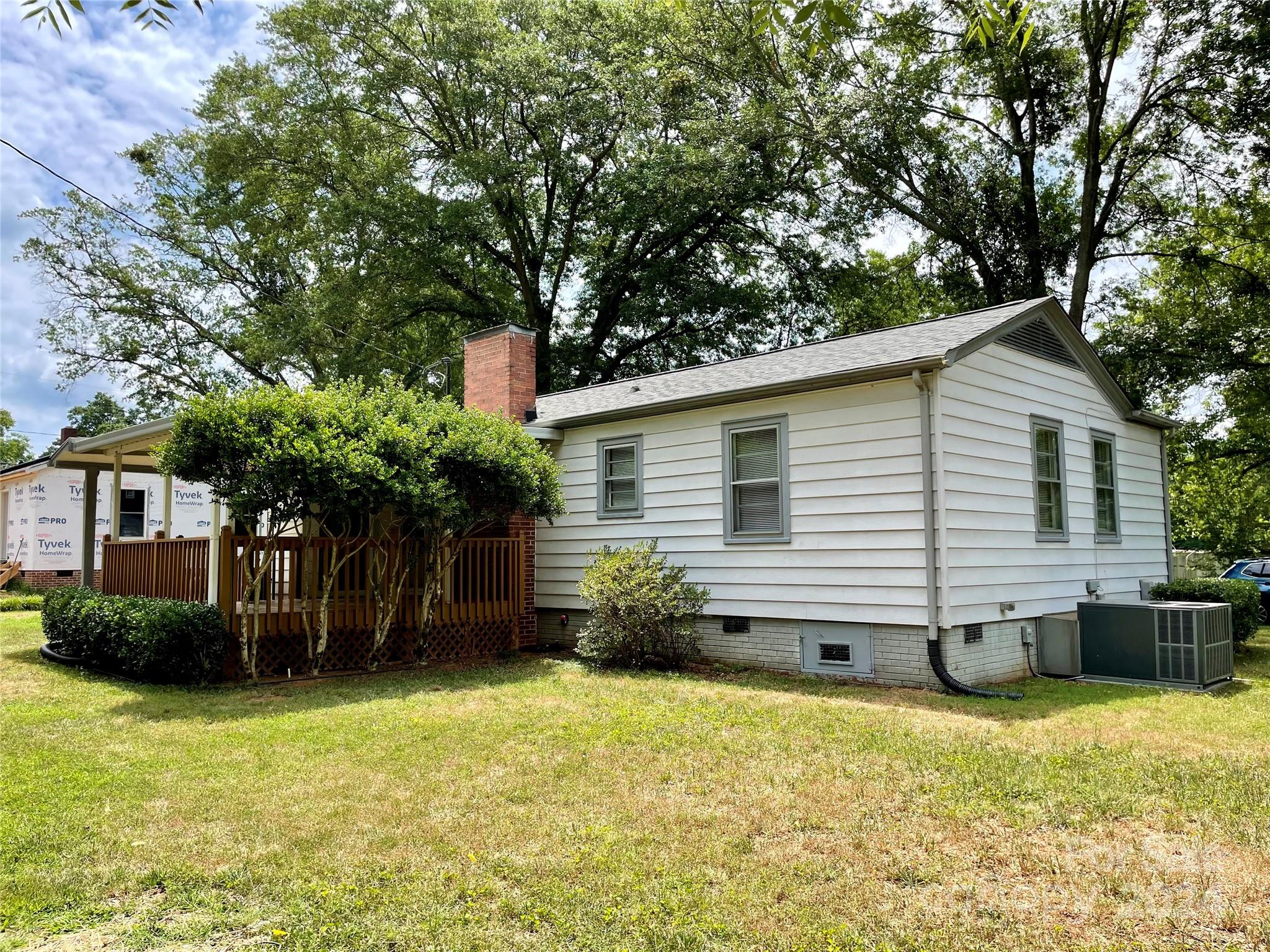 304 Rhyne Street Stanley, NC 28164 - Photo 22 of 38 a view of a house with a backyard