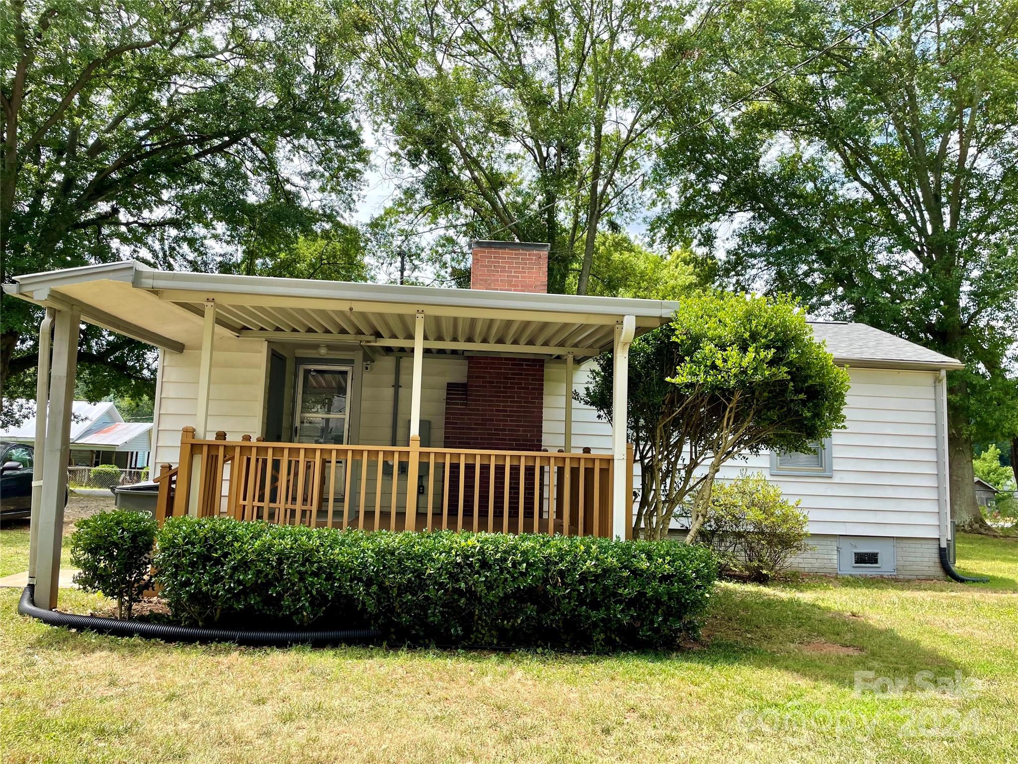 304 Rhyne Street Stanley, NC 28164 - Photo 23 of 38 a front view of a house with a garden