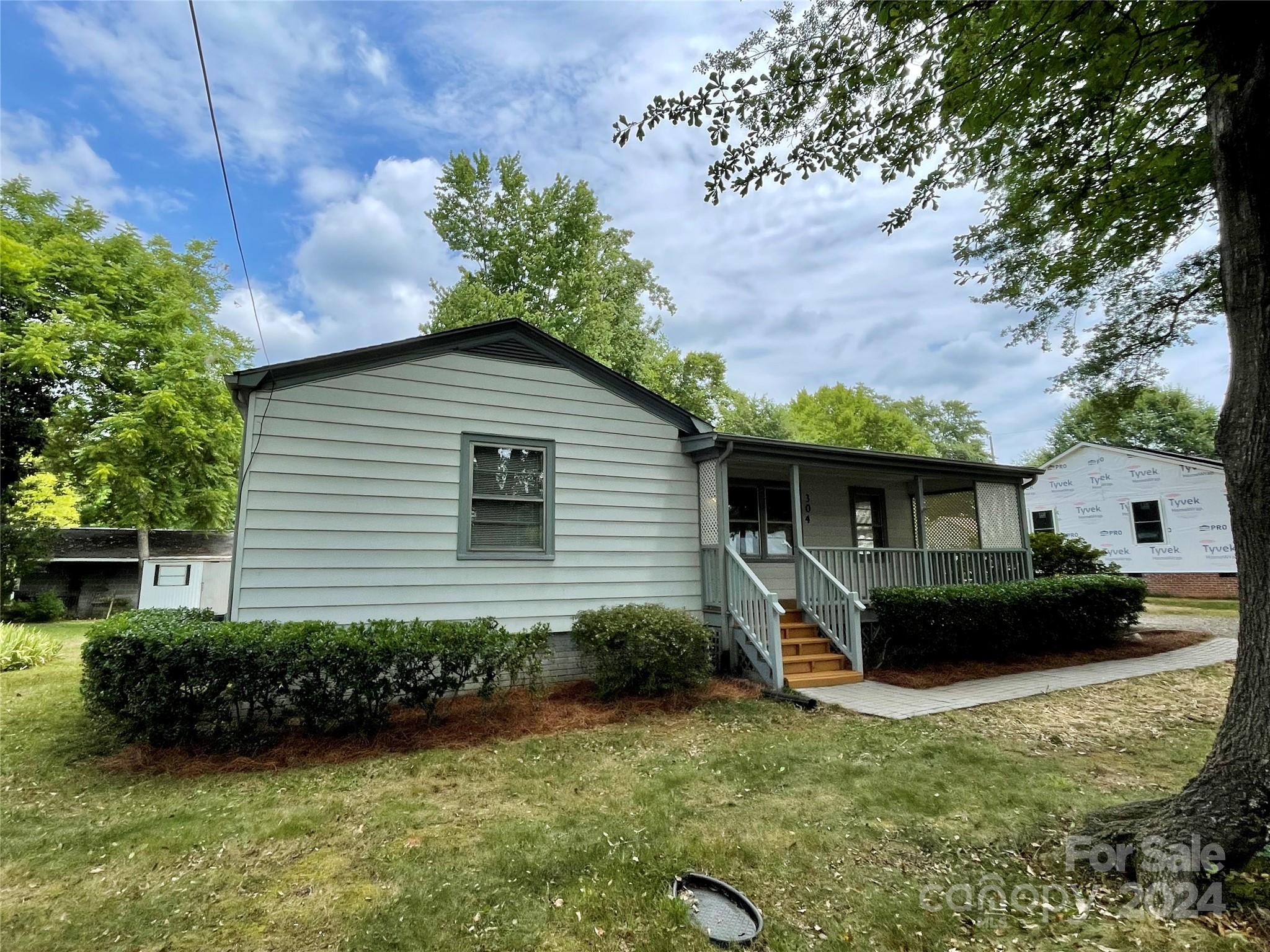 304 Rhyne Street Stanley, NC 28164 - Photo 24 of 38 a front view of a house with garden