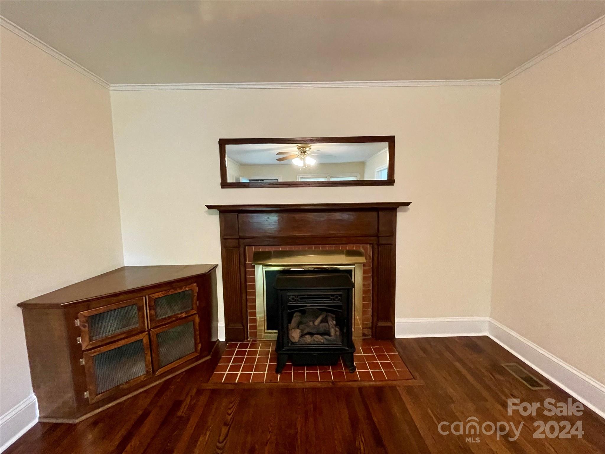 304 Rhyne Street Stanley, NC 28164 - Photo 27 of 38 a living room with a fireplace