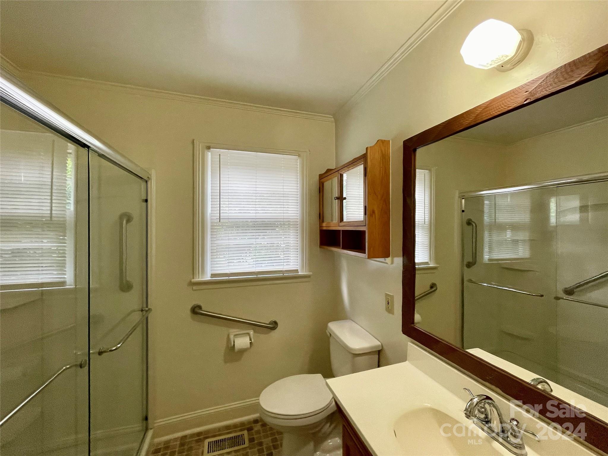304 Rhyne Street Stanley, NC 28164 - Photo 34 of 38 a bathroom with a toilet a sink and shower