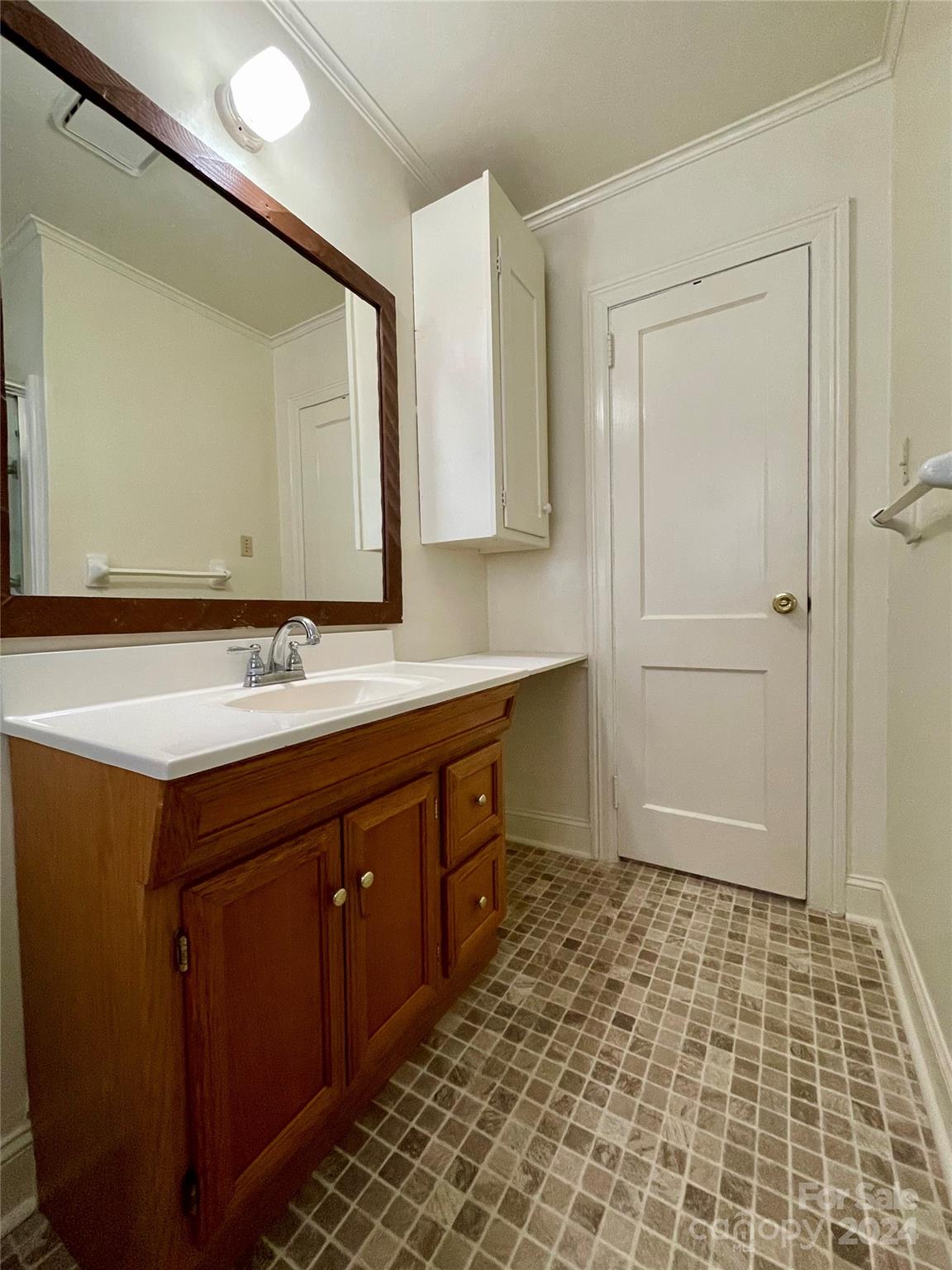 304 Rhyne Street Stanley, NC 28164 - Photo 35 of 38 a bathroom with a sink a mirror and a shower