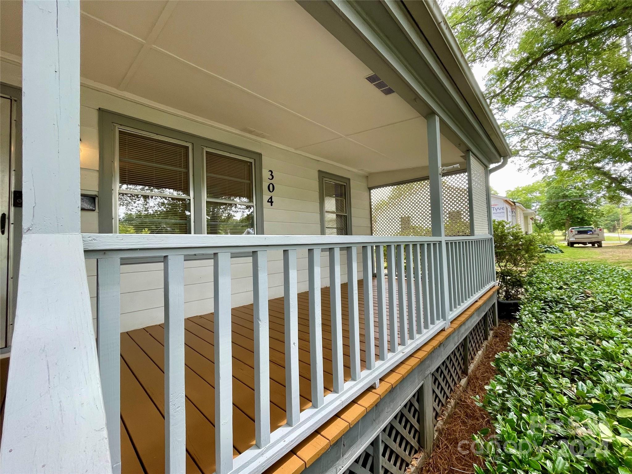 304 Rhyne Street Stanley, NC 28164 - Photo 4 of 38 a view of wooden balcony