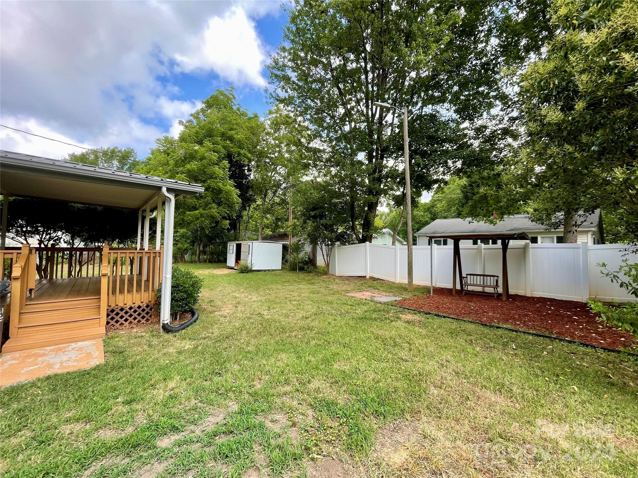 304 Rhyne Street Stanley, NC 28164 - Photo 5 of 38 a front view of a house with garden