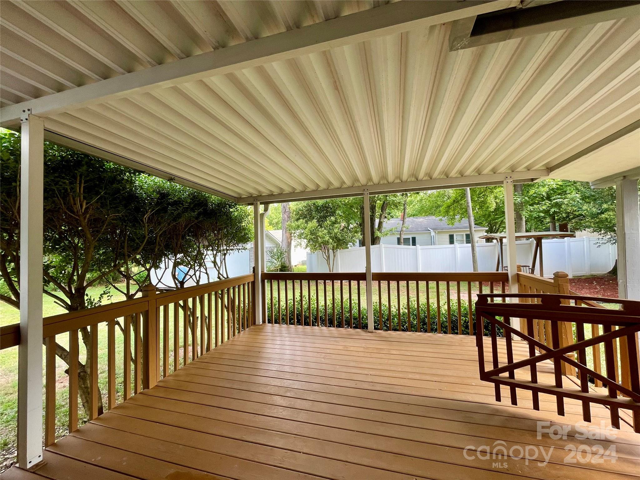 304 Rhyne Street Stanley, NC 28164 - Photo 7 of 38 a view of a wooden deck