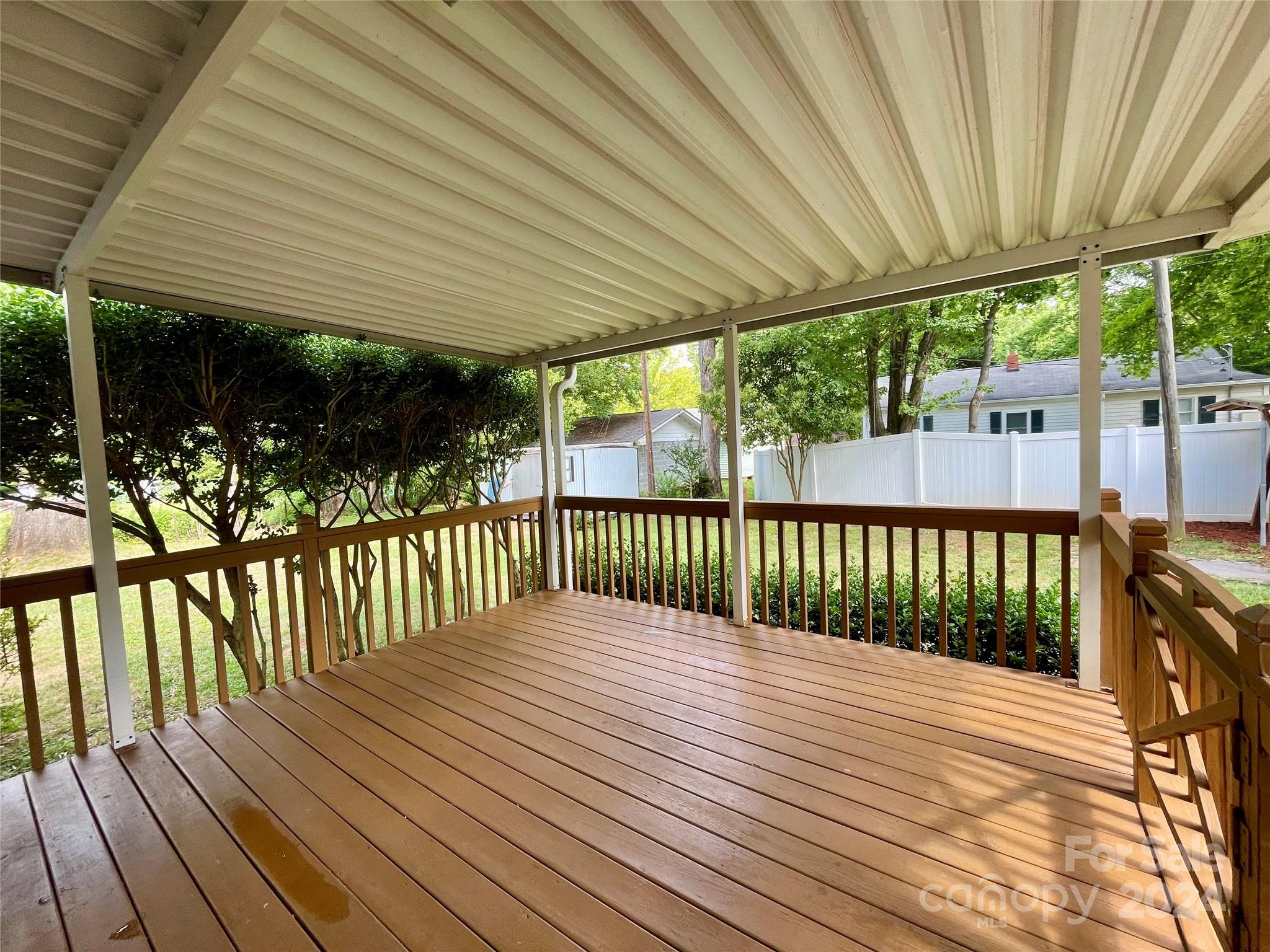 304 Rhyne Street Stanley, NC 28164 - Photo 9 of 38 a view of a wooden deck