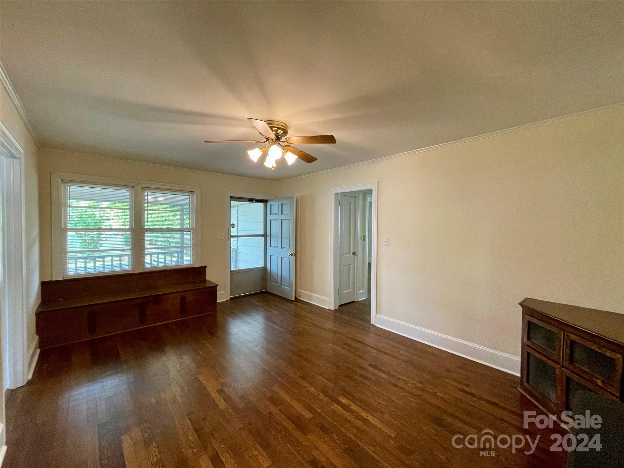 304 Rhyne Street Stanley, NC 28164 - Photo 10 of 38 an empty room with wooden floor and windows