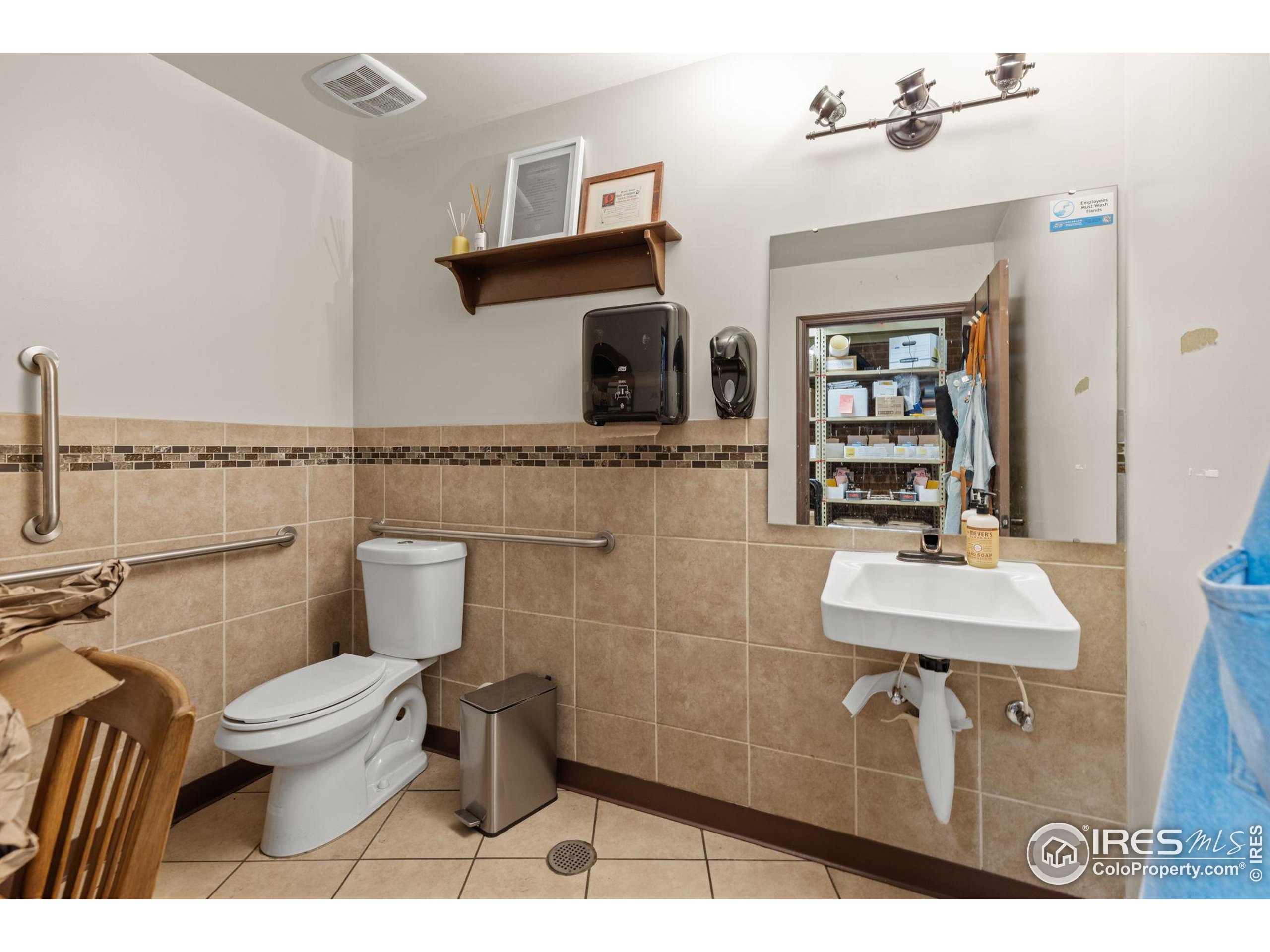 331 Main Street Longmont, CO 80501 - Photo 14 of 50 a bathroom with a sink toilet and mirror