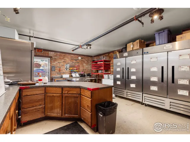 a open kitchen with stainless steel appliances granite countertop a sink and cabinets