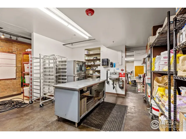 a open kitchen with stainless steel appliances granite countertop a stove and cabinets