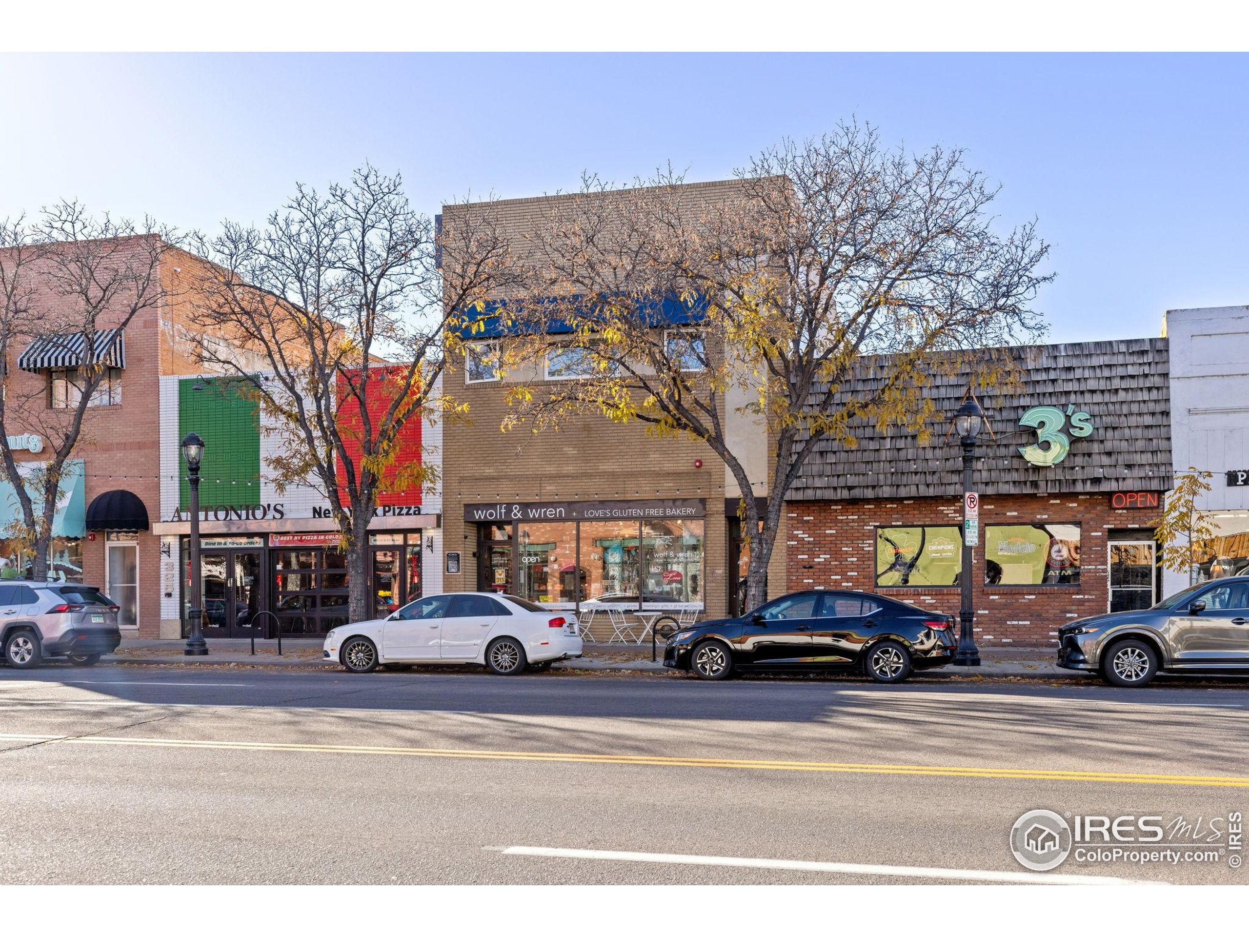 331 Main Street Longmont, CO 80501 - Photo 2 of 50 a view of a cars parked on the side of a street