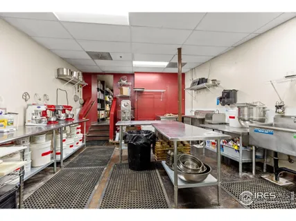 a very nice looking room with lots of furniture and white walls