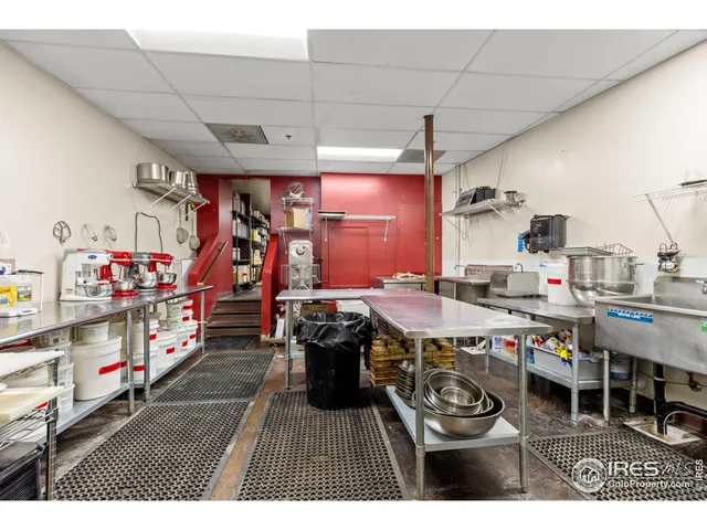 a very nice looking room with lots of furniture and white walls